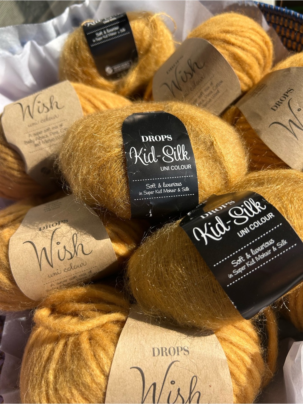 Drops Wish Yarn
Drops Kid Silk 

Color Curry.